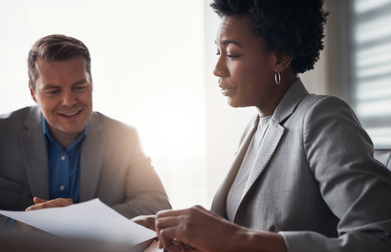 woman and man looking over paperwork